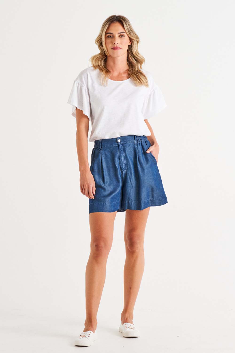 A model wearing the Gabriella Lyocell Short in colour Bluehaze (Blue), from the front, showing the whole outfit