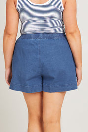 Model Poppy wearing size 16 of the Caroline Denim Short in colour Lightwash (Blue), from the back