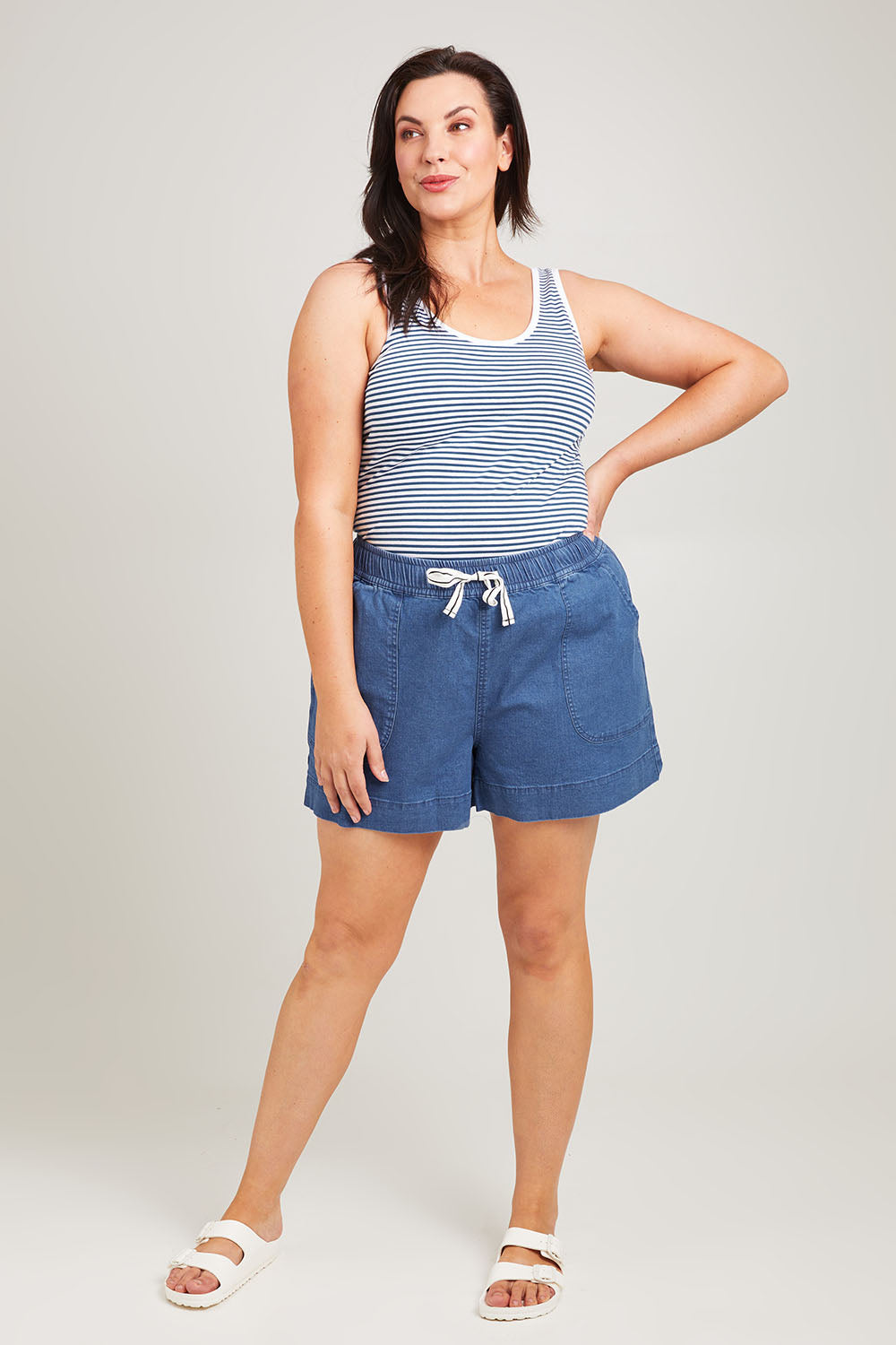 Model Poppy wearing size 16 of the Caroline Denim Short in colour Lightwash (Blue), from the front, showing the whole outfit