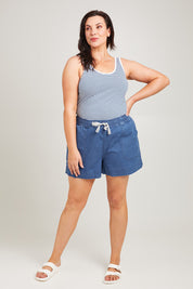 Model Poppy wearing size 16 of the Caroline Denim Short in colour Lightwash (Blue), from the front, showing the whole outfit