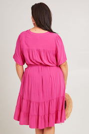 Model Poppy wearing size 16 of the Port Douglas Dress in colour Frenchrose (Pink), from the back