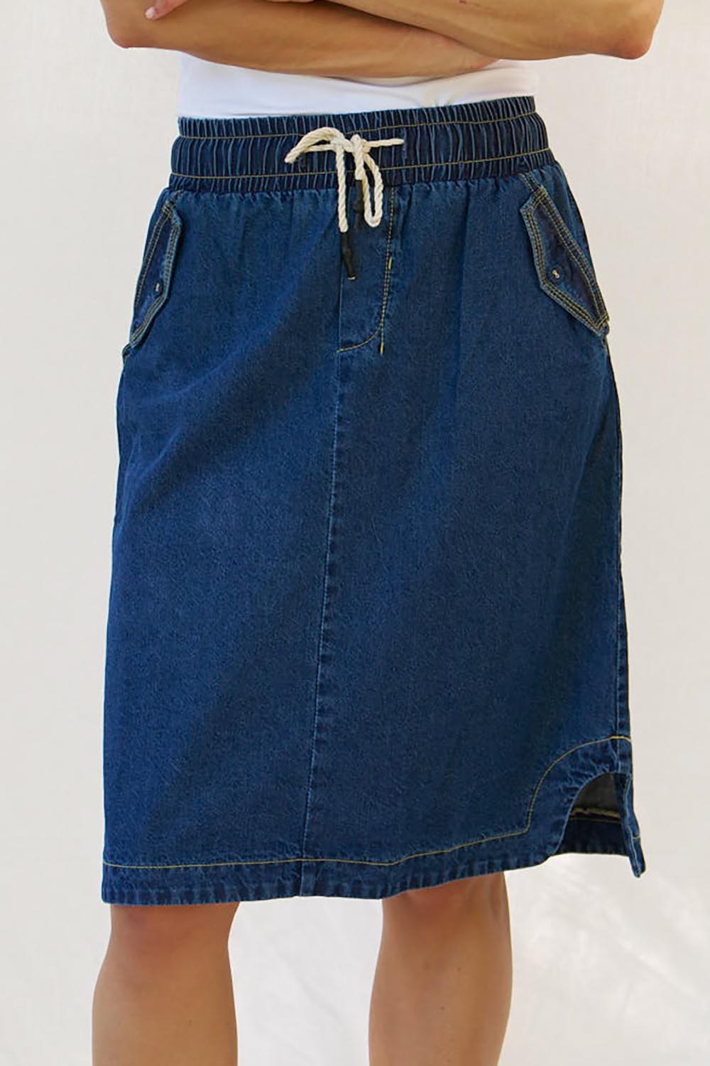 A model wearing the Desiree Cotton Denim Skirt in colour Bluewash (Blue), from the front, cropped image
