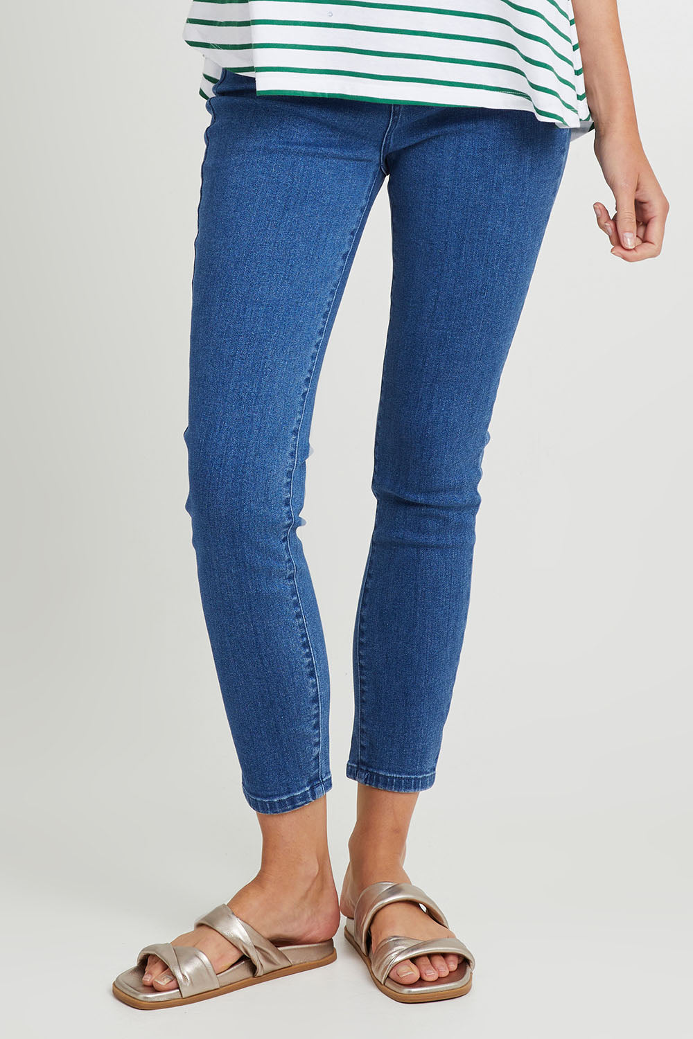 Model Madeline wearing size 10 of the Betty Essential Jean in colour Vintage (Blue), from the front, cropped image