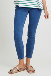 Model Madeline wearing size 10 of the Betty Essential Jean in colour Vintage (Blue), from the front, cropped image