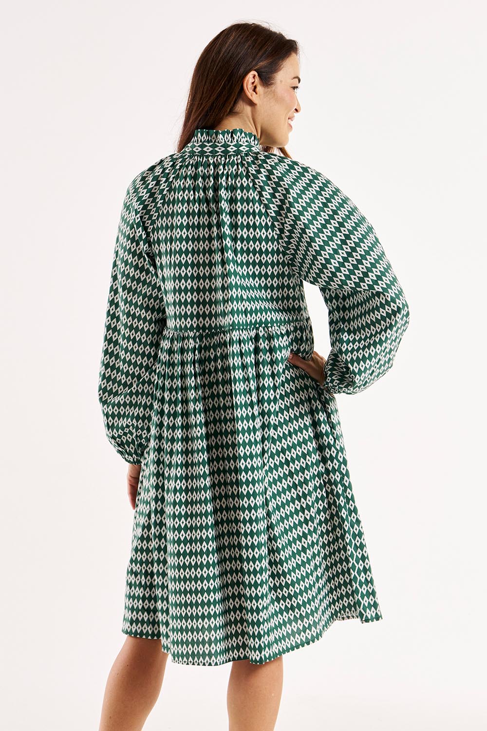 A model wearing the Cottage Dress in colour Diamond (Black), from the back