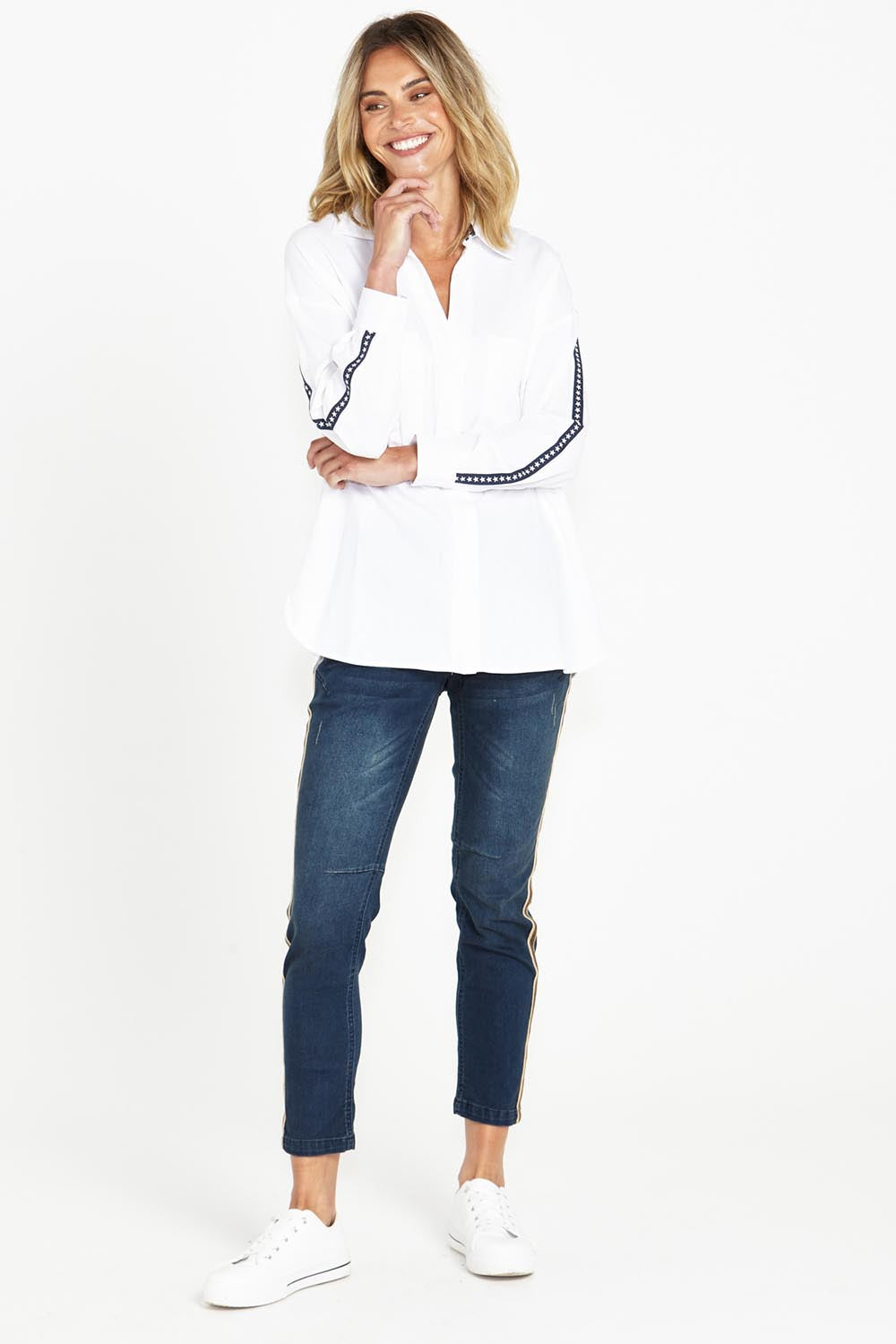 A model wearing the Delia Star Pocket Shirt in colour Whitestars (White), from the front, showing the whole outfit