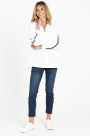 A model wearing the Delia Star Pocket Shirt in colour Whitestars (White), from the front, showing the whole outfit
