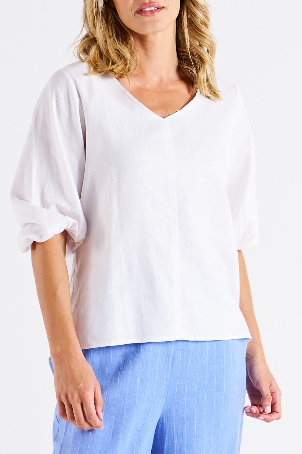 A model wearing the Elanora Linen Blend Blouse in colour White (White), from the back