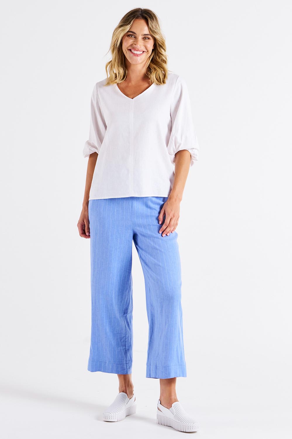 A model wearing the Elanora Linen Blend Blouse in colour White (White), from the front, showing the whole outfit