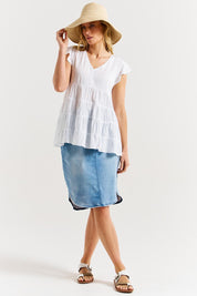A model wearing the Danica Frill Top in colour White (White), from the front, showing the whole outfit