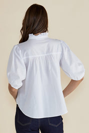 A model wearing the Avery Cotton Blouse in colour White (White), from the back
