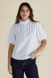 A model wearing the Avery Cotton Blouse in colour White (White), from the front, cropped image