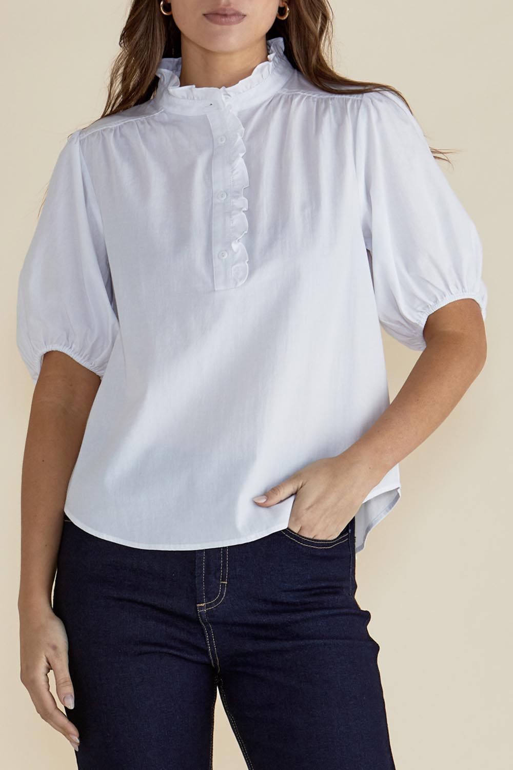 A model wearing the Avery Cotton Blouse in colour White (White), from the front, cropped image