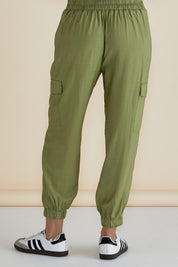 A model wearing the Adrianna Jogger in colour Pistachio (Green), from the back