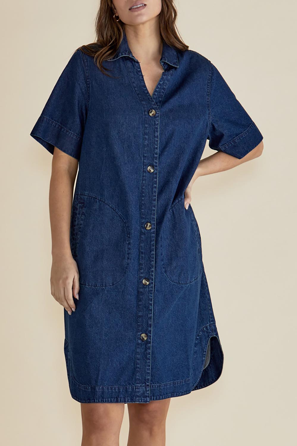 A model wearing the Dawson Denim Dress in colour Vintage (Blue), from the front, cropped image