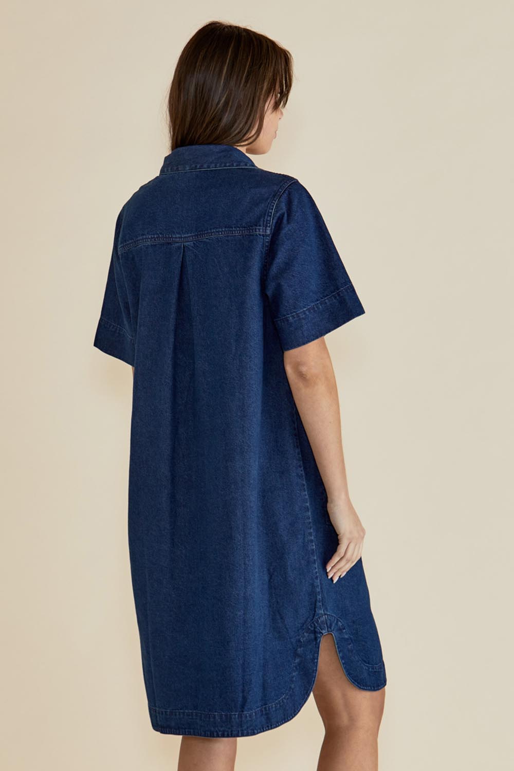 A model wearing the Dawson Denim Dress in colour Vintage (Blue), from the front, cropped image