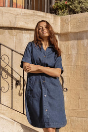 A model wearing the Dawson Denim Dress in colour Vintage (Blue), from the front, showing the whole outfit