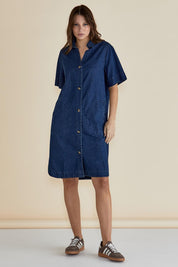A model wearing the Dawson Denim Dress in colour Vintage (Blue), from the front, showing the whole outfit