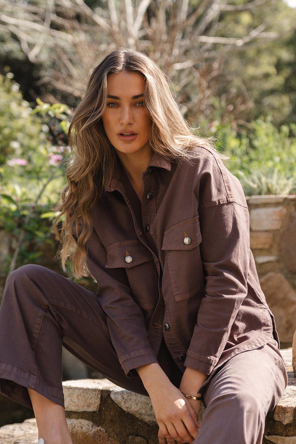 A model wearing the Cherry Denim Shirt in colour Coco, from the front, showing the whole outfit