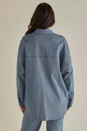 A model wearing the Cherry Denim Shirt in colour Pinstripe (Blue), from the back