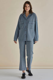 A model wearing the Cherry Denim Shirt in colour Pinstripe (Blue), from the front, showing the whole outfit