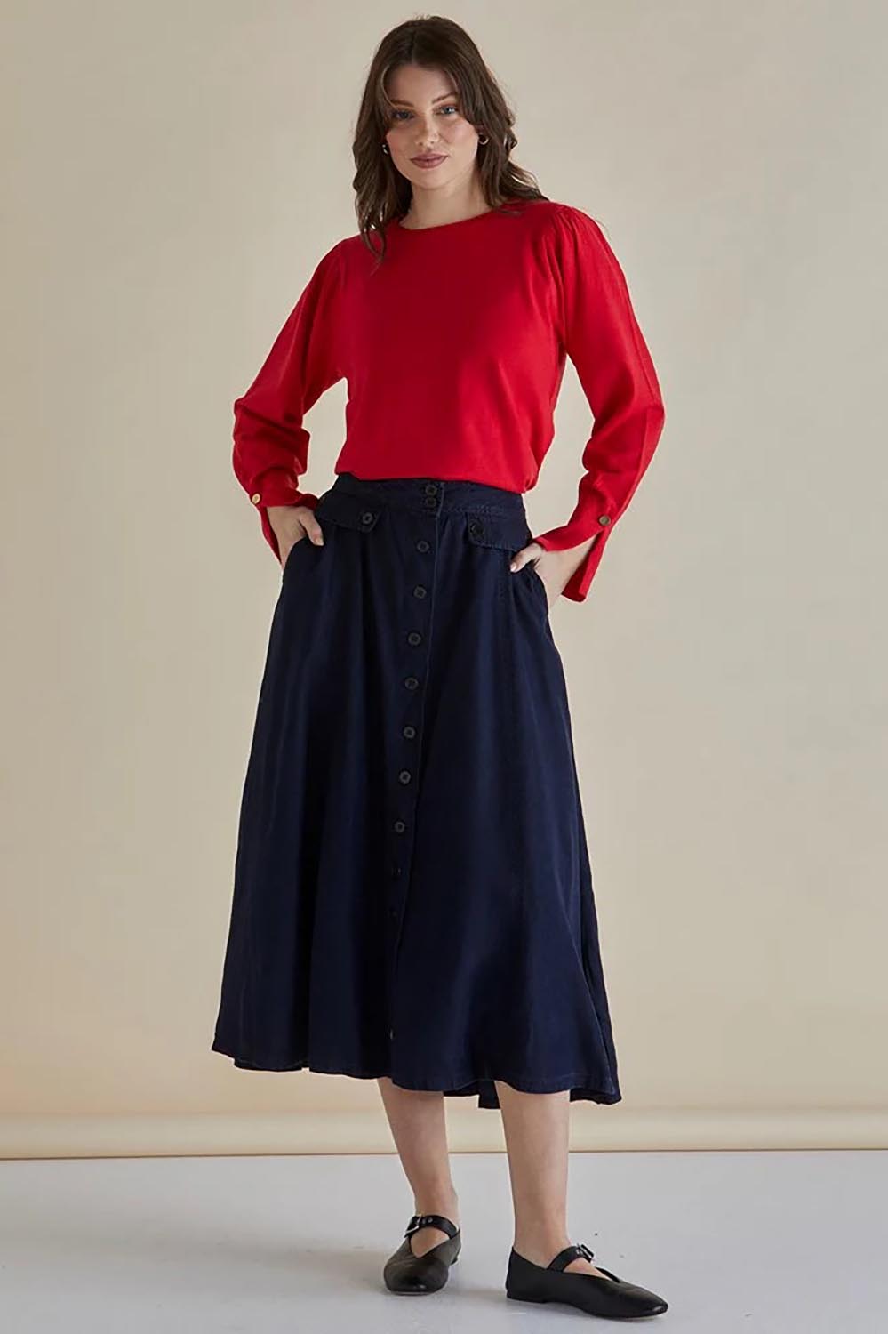 A model wearing the Lola Lyocell Skirt in colour Drkvintage (Blue), from the front, showing the whole outfit