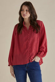 A model wearing the Marie Blouse in colour DustyPink (Pink), from the front, cropped image