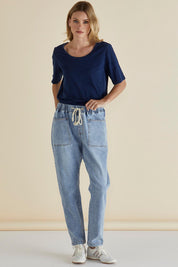 A model wearing the Haven Straight Leg Jean in colour Lightblue (Blue), from the front, showing the whole outfit