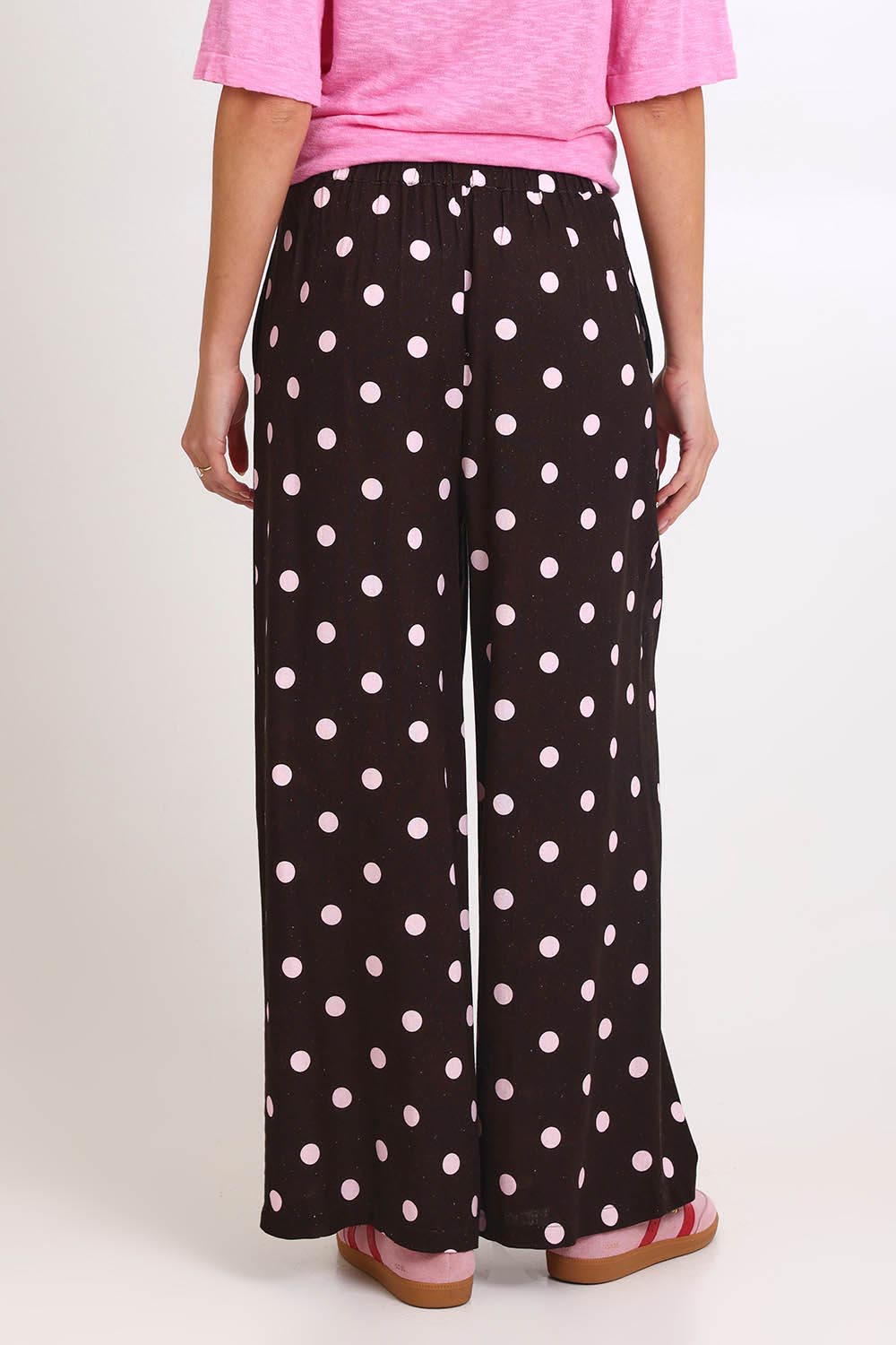 Model Madelinec wearing size 10 of the Zander Pant – Pinkchoc in colour Pinkchoc, from the back