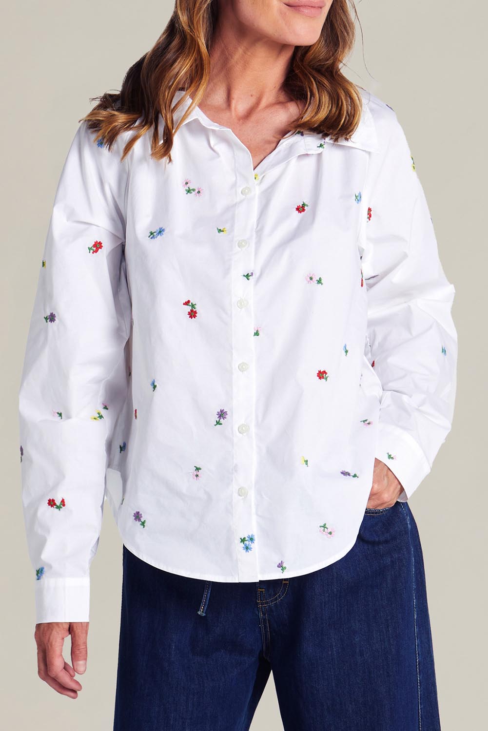 A model wearing the Floral Embroidered Cotton Shirt in colour Floral (White), from the front, cropped image