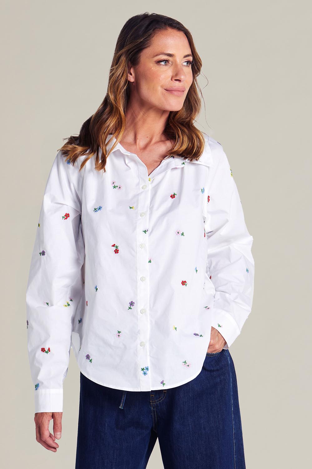 A model wearing the Floral Embroidered Cotton Shirt in colour Floral (White), from the front, showing the whole outfit