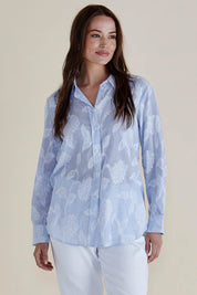 A model wearing the Lace Stripe Cotton Shirt in colour Lacefloral (Blue), from the front, cropped image
