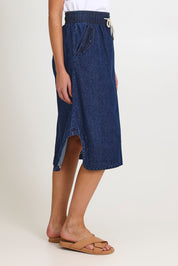 Model Madeline wearing size 10 of the Lizbeth Denim Skirt in colour Bluewash (Blue), from the front, cropped image