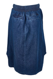 Product shot of the Lizbeth Denim Skirt in colour Bluewash (Blue), from the back