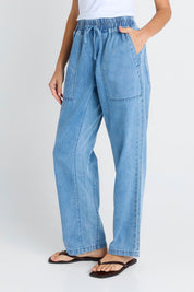 Model Genericm wearing size sample of the Quinn Cotton Jogger – Bluemed in colour Bluemed, from an angle