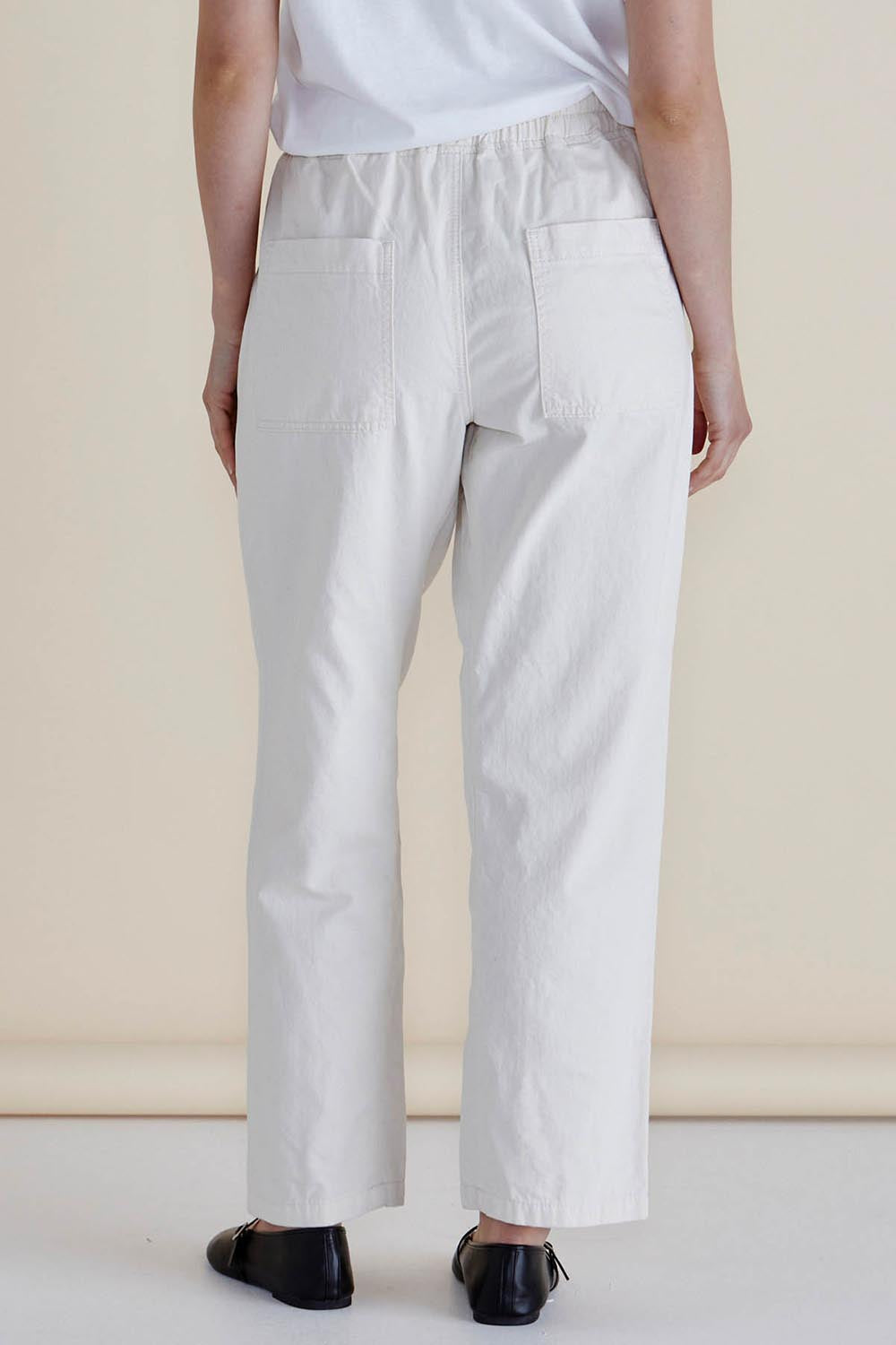 A model wearing the Quinn Cotton Jogger in colour White (White), from the back