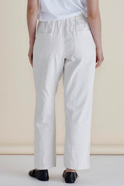 A model wearing the Quinn Cotton Jogger in colour White (White), from the back
