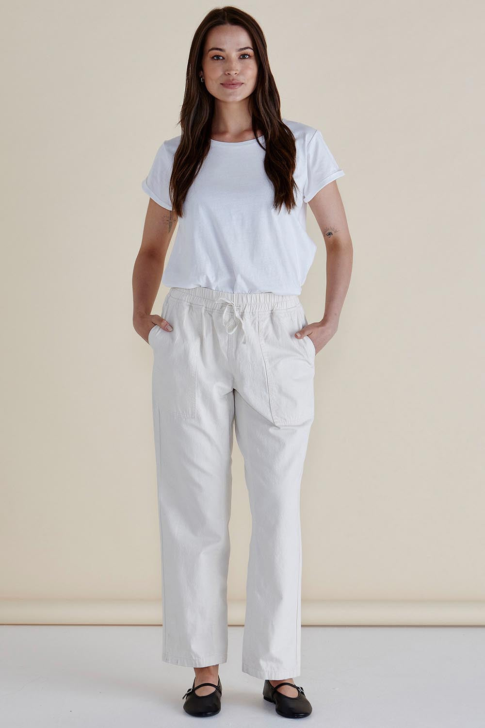 A model wearing the Quinn Cotton Jogger in colour White (White), from the front, showing the whole outfit