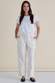 A model wearing the Quinn Cotton Jogger in colour White (White), from the front, showing the whole outfit