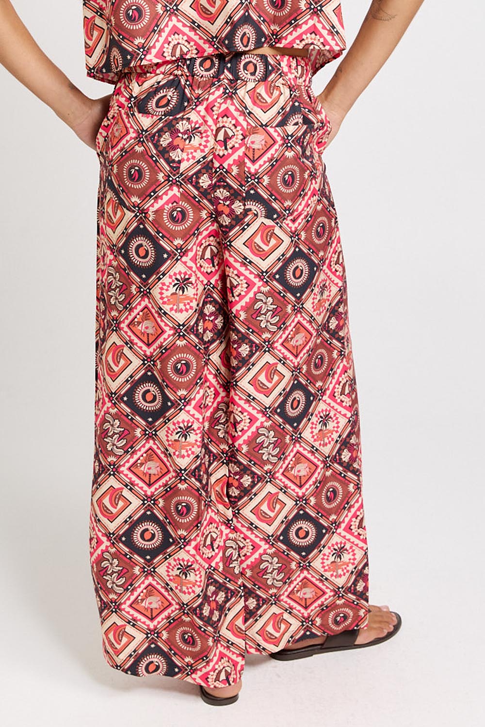 Model Genericm wearing size sample of the Sable Wide Leg Pant – Coco in colour Coco, from an angle