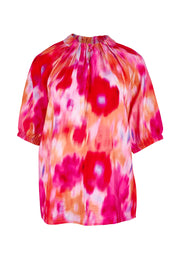 Product shot of the Joanne Blouse in colour Floral (Pink), from the front