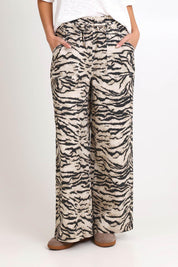 Model Madelinec wearing size 10 of the Saffra Relax Leg Jean – Animal in colour Animal, from the front