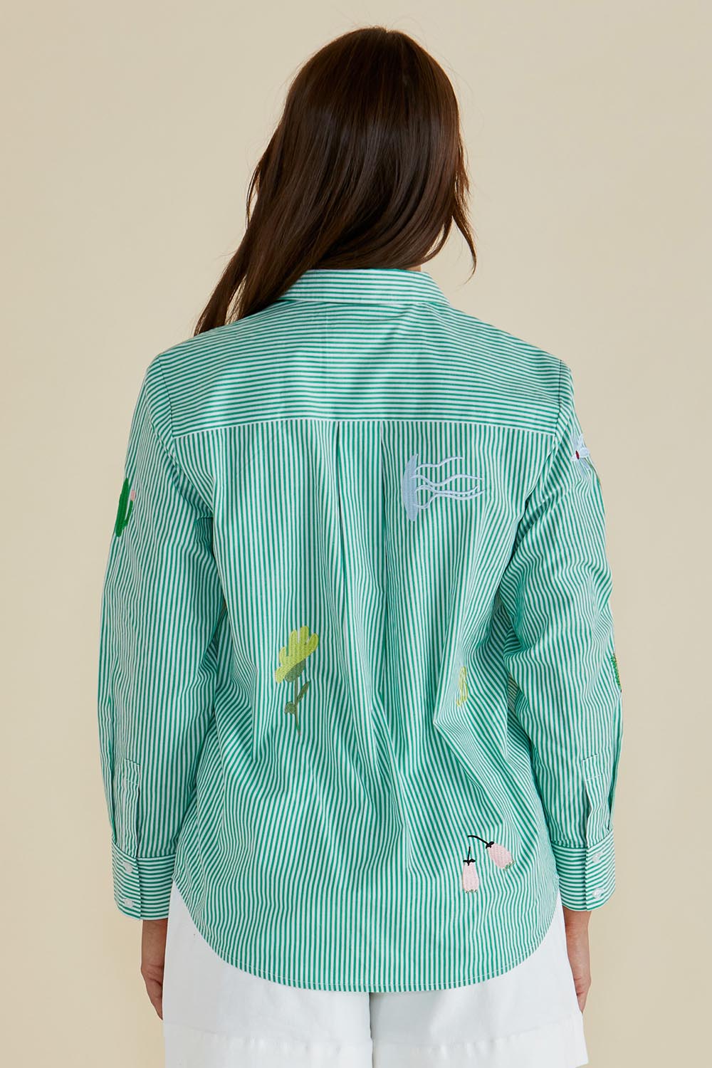 A model wearing the Kimmie Floral Cotton Shirt in colour Green (Green), from the back