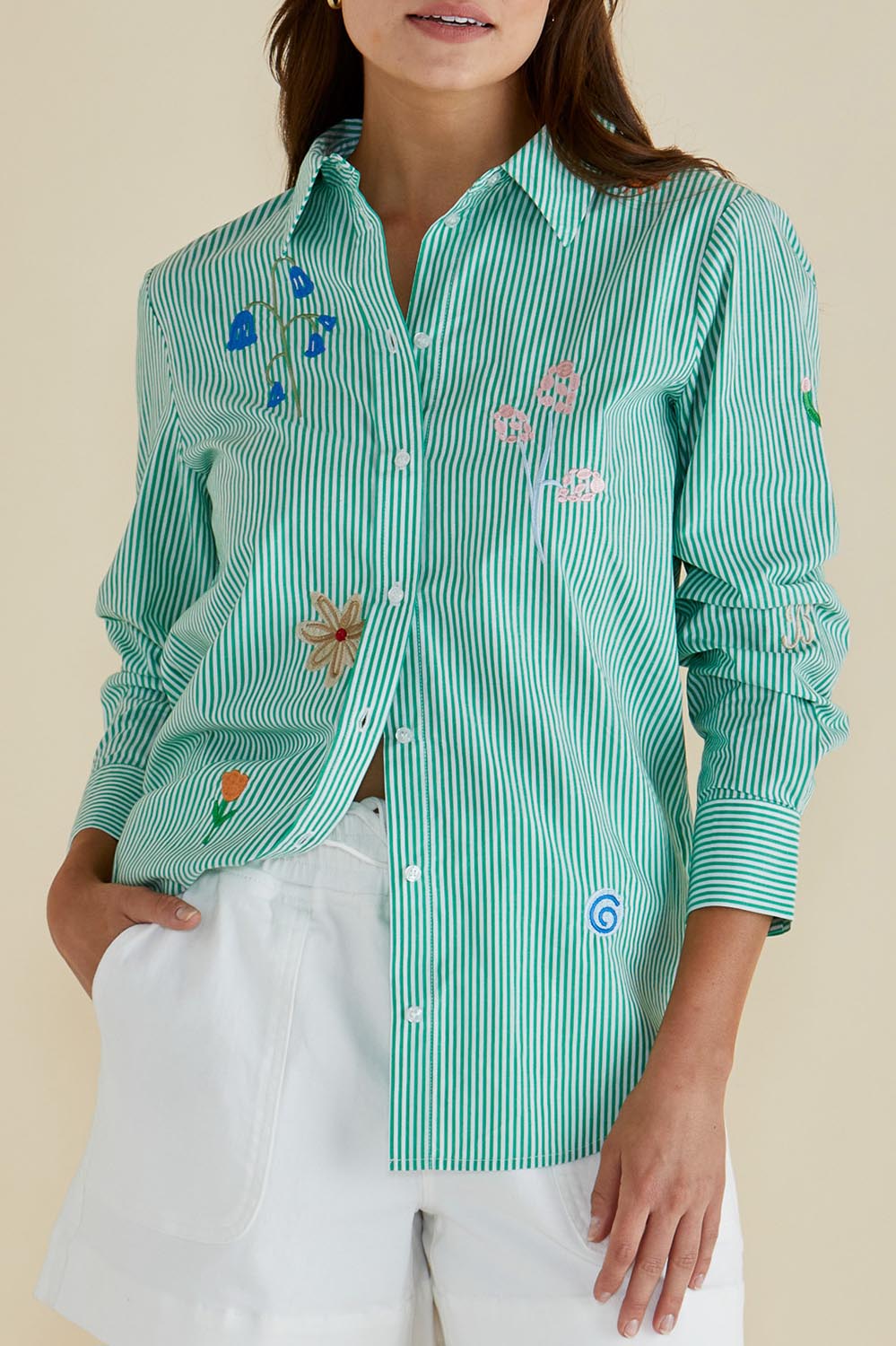 A model wearing the Kimmie Floral Cotton Shirt in colour Green (Green), from the front, cropped image