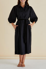 A model wearing the Angelina Linen Blend Dress in colour Black (Black), from the front, cropped image