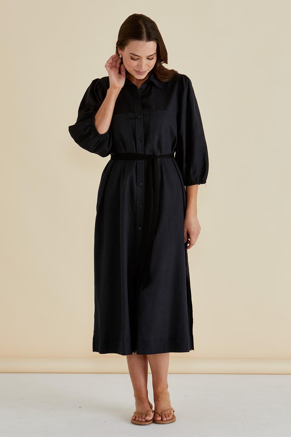 A model wearing the Angelina Linen Blend Dress in colour Black (Black), from the front, showing the whole outfit