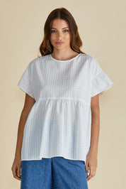 A model wearing the Poppy Cotton Blend Blouse in colour White (White), from the front, cropped image
