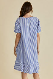 A model wearing the Livvy Cotton Blend Dress in colour Navystripe (Blue), from the back