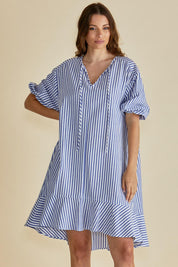 A model wearing the Livvy Cotton Blend Dress in colour Navystripe (Blue), from the front, cropped image