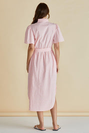 A model wearing the Immie Cotton Dress in colour Pink (Pink), from the back